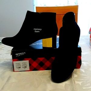 Women's black with gold heel booties. Brand new. Never worn.